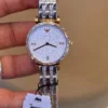 emporio-armani-ar11293-montre-femme-cadran-cristaux.webp EMPORIO ARMANI Gianni T-Bar AR11293 Montre Femme Bicolore Cristaux