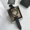 guess-gw0263g1-momentum-boite-originale-homme-au-maroc.webp Guess GW0263G1 Momentum montre homme dorée avec cadran noir et bracelet silicone noir
