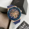 Guess GW0263G2 Momentum montre homme dorée rose avec cadran bleu et bracelet silicone bleu