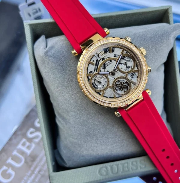 Guess GW0484L1 Solstice montre femme dorée avec cadran transparent et bracelet rouge