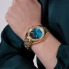 guess-gw0770l2-desire-montre-femme-poignet.webp GUESS GW0770L2 Desire – Montre femme dorée à cadran vert nacré