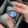 guess-gw0873l1-montre-femme-dans-sa-boite.webp GUESS Empress GW0873L1 Montre Femme Argentée Cadran Bleu
