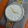 michael-kors-mk1041-pyper-bracelet-acier-bicolore.webp Michael Kors MK1041 Pyper – Montre femme bicolore pavée