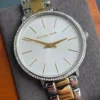 michael-kors-mk1041-pyper-coffret-montre-bracelet-boucles.webp Michael Kors MK1041 Pyper – Montre femme bicolore pavée
